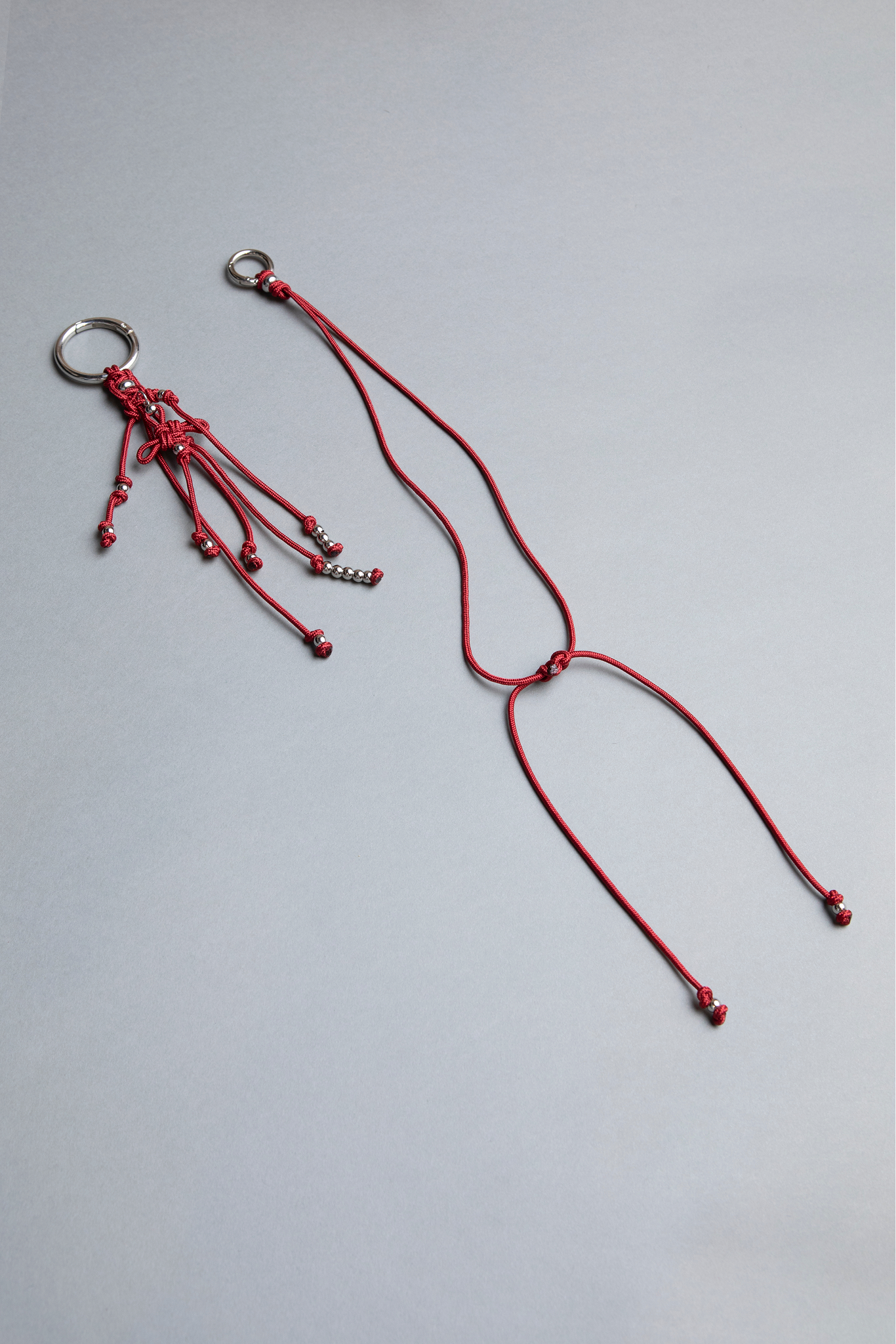 red statement piece keychain, phone case holder and separate accessories, big and small crabins