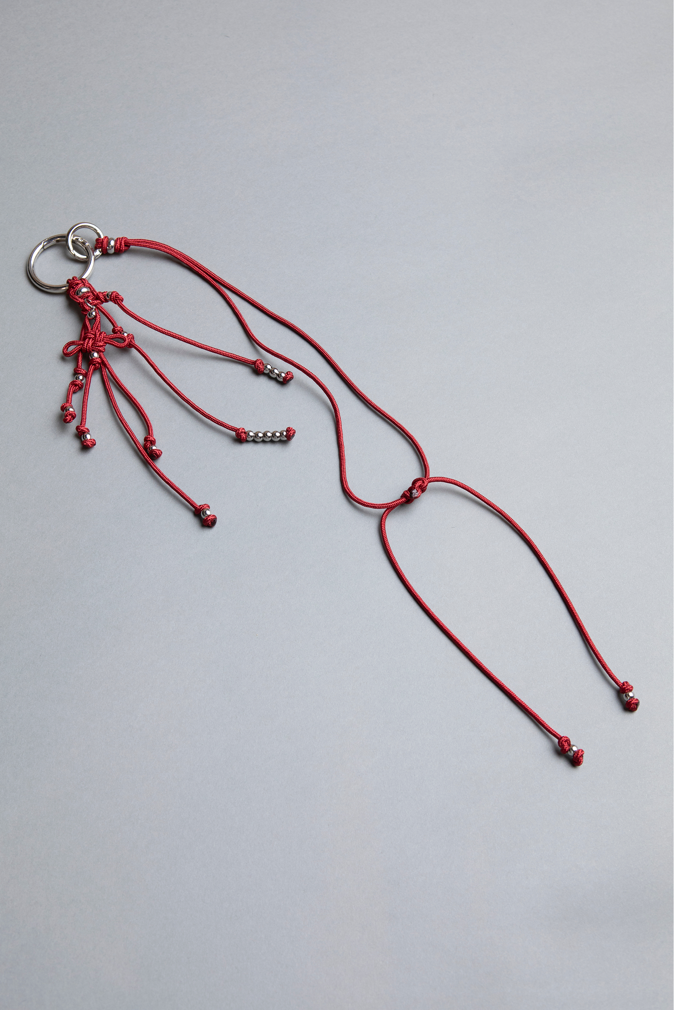 red statement piece keychain, phone case holder and separate accessories, big and small crabins