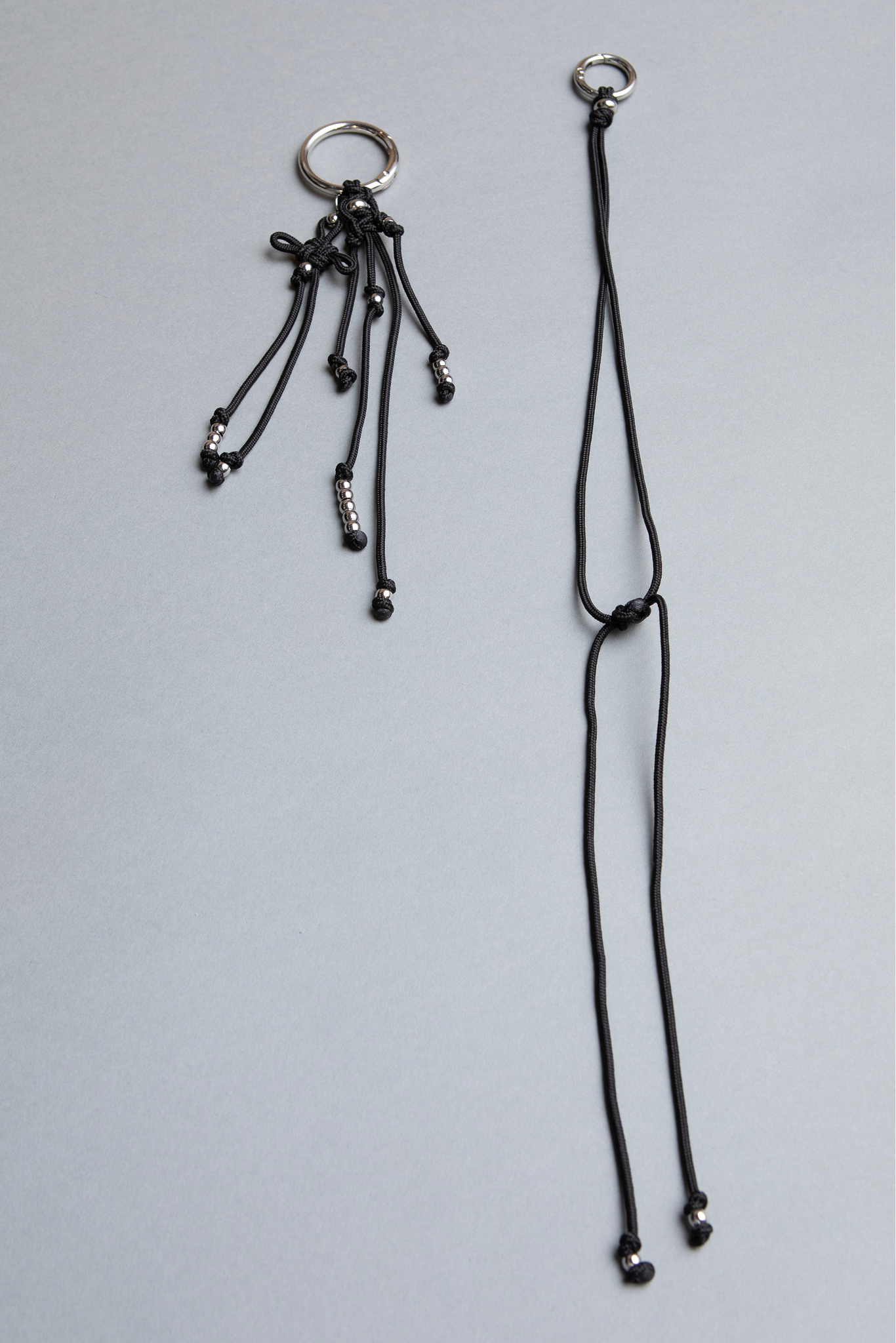 Black statement piece keychain, phone case holder and separate bag and pants accessory