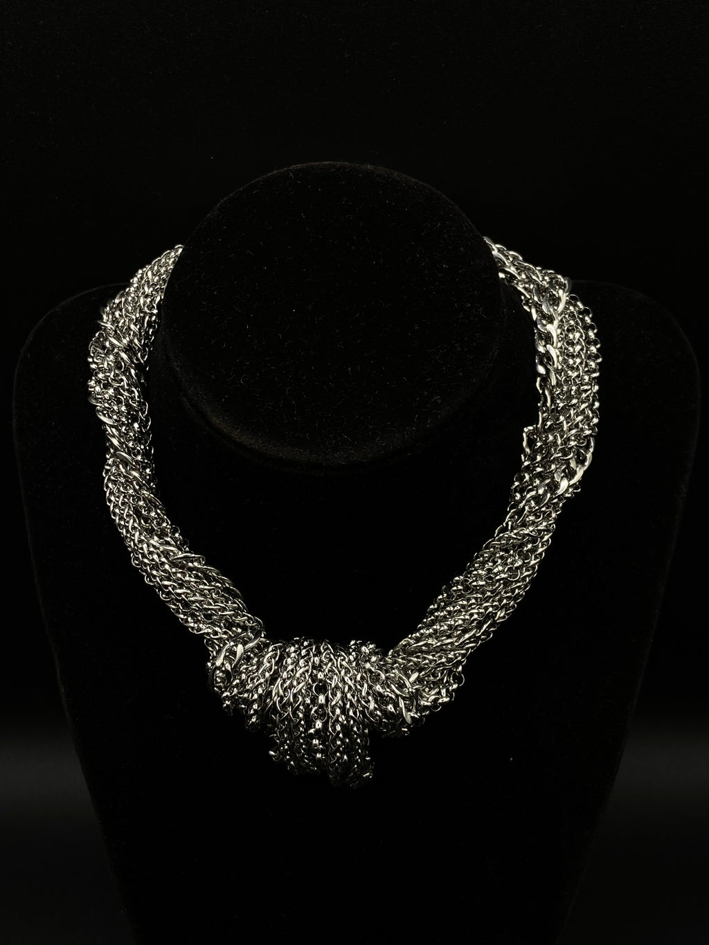 Silver necklace on a black background