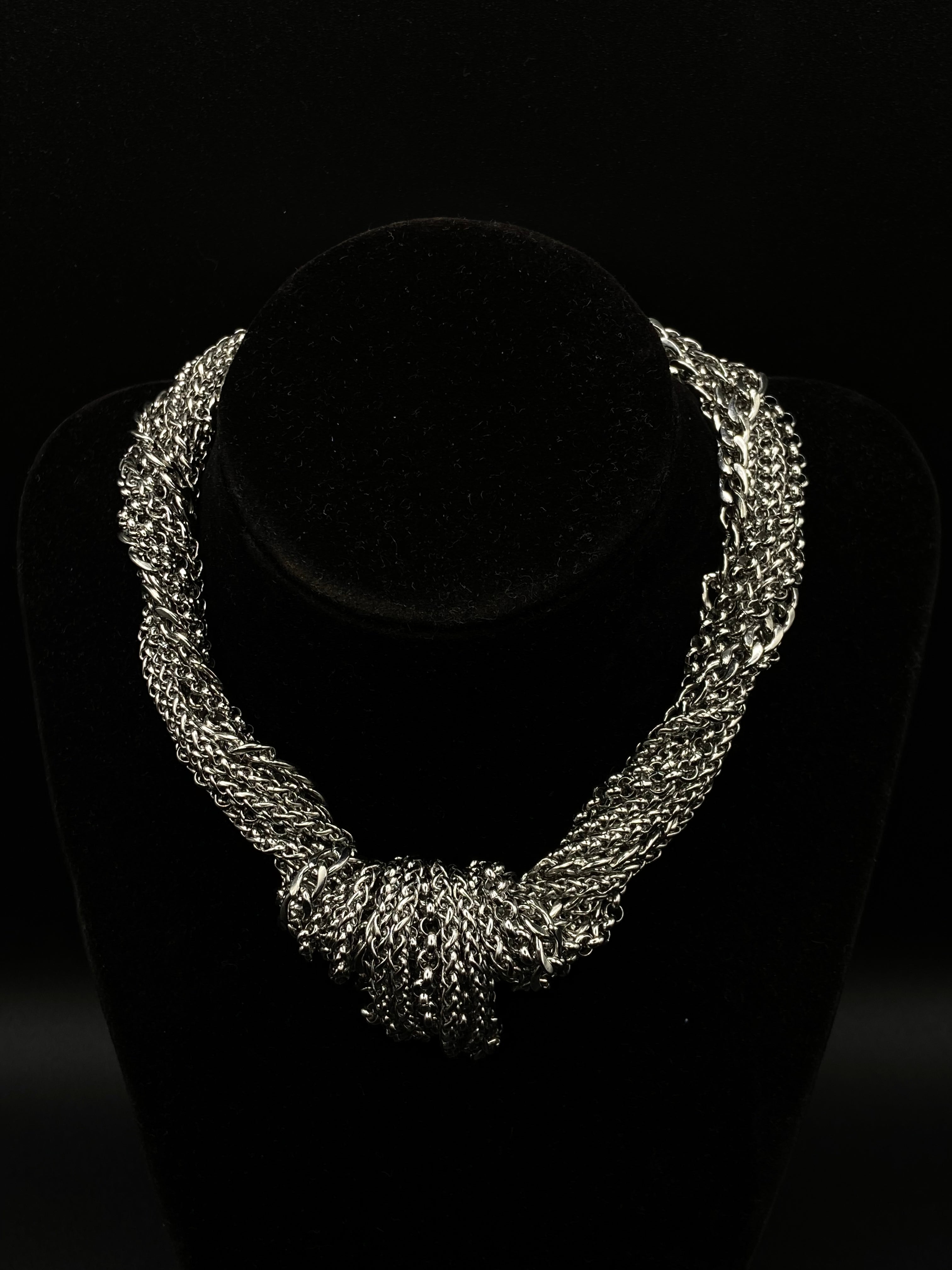 Silver necklace on a black background