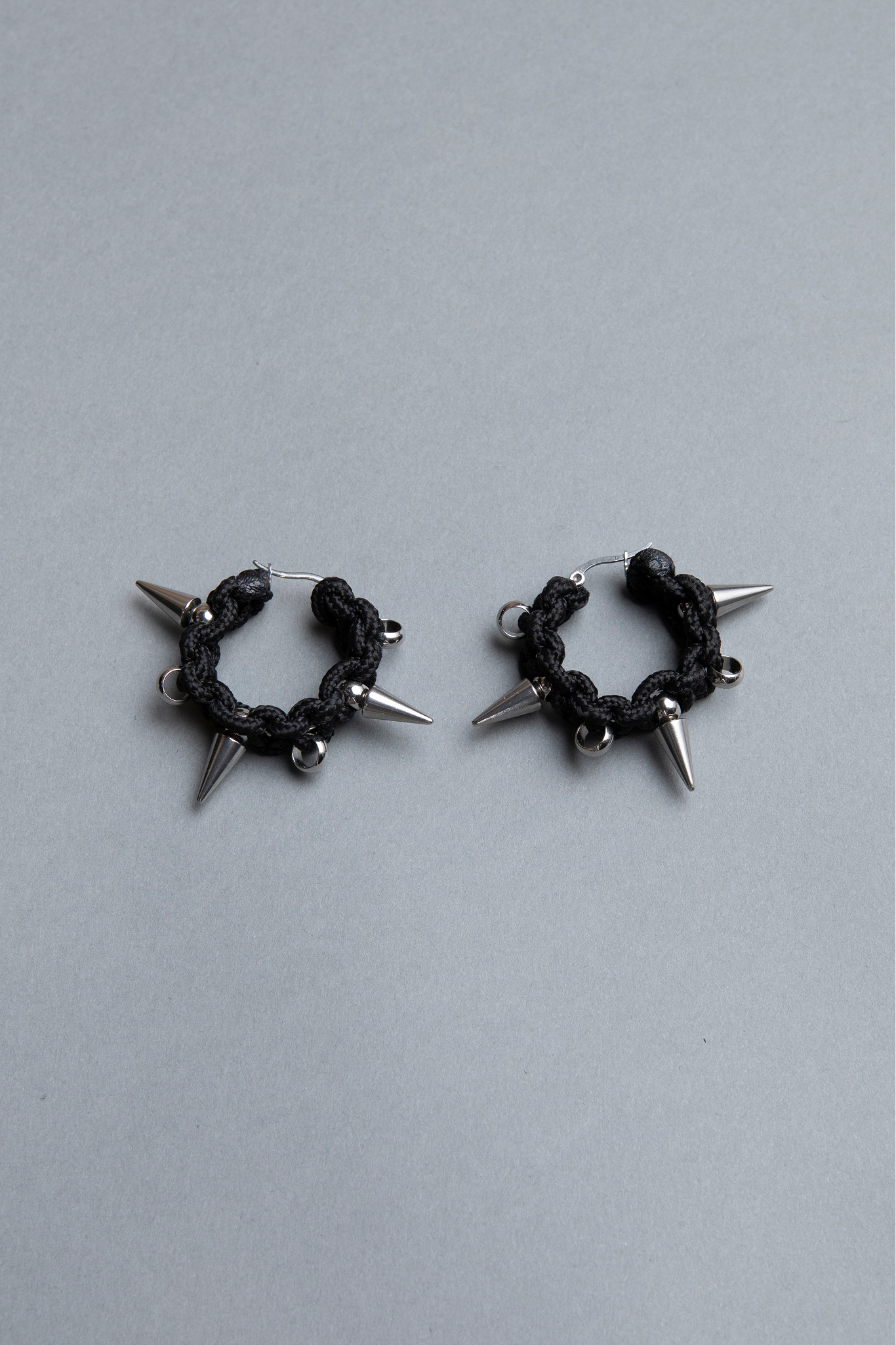 pair of black spiky hoop earrings