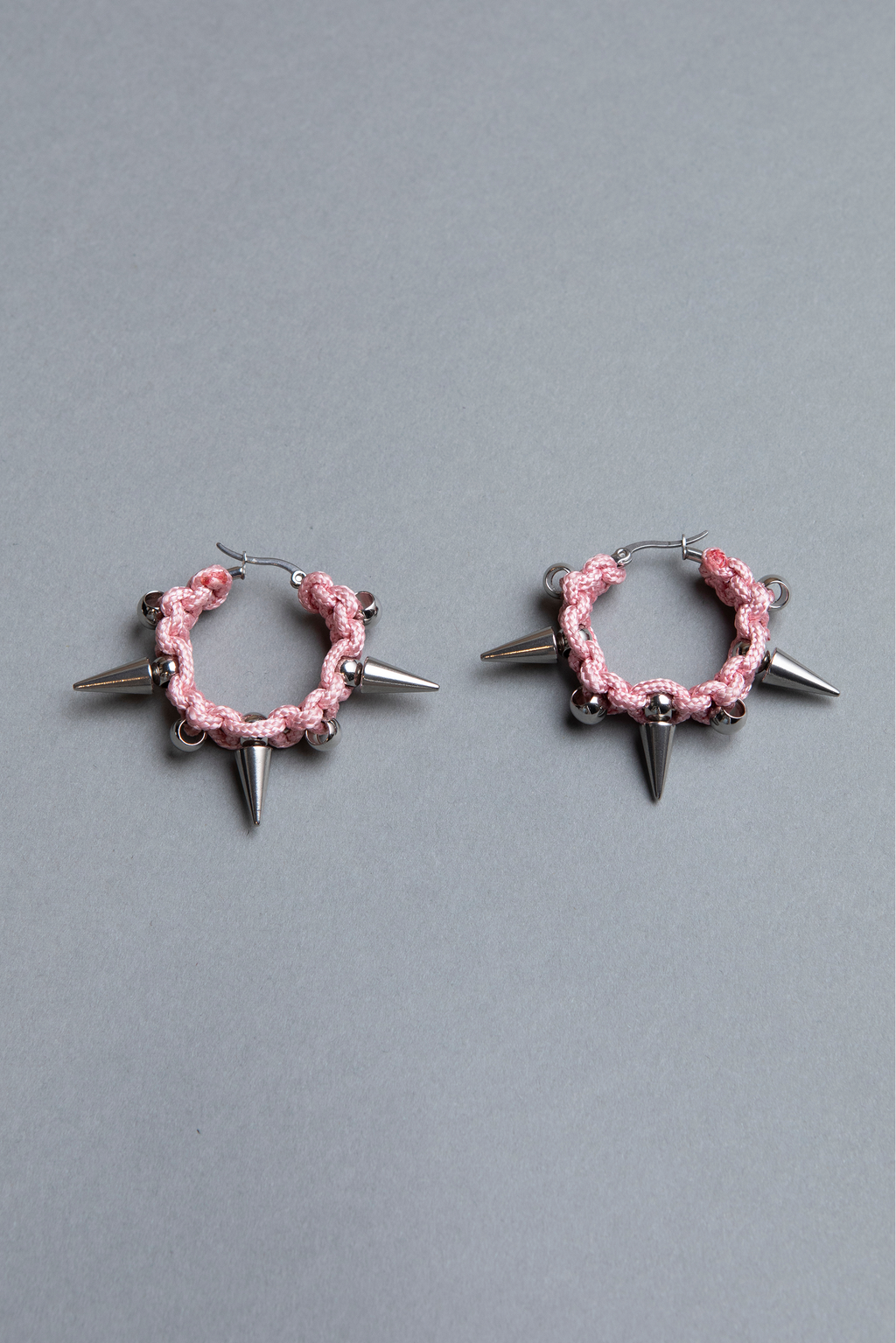 pair of unisex big pair of unisex big pink  spiky hoop earrings 
