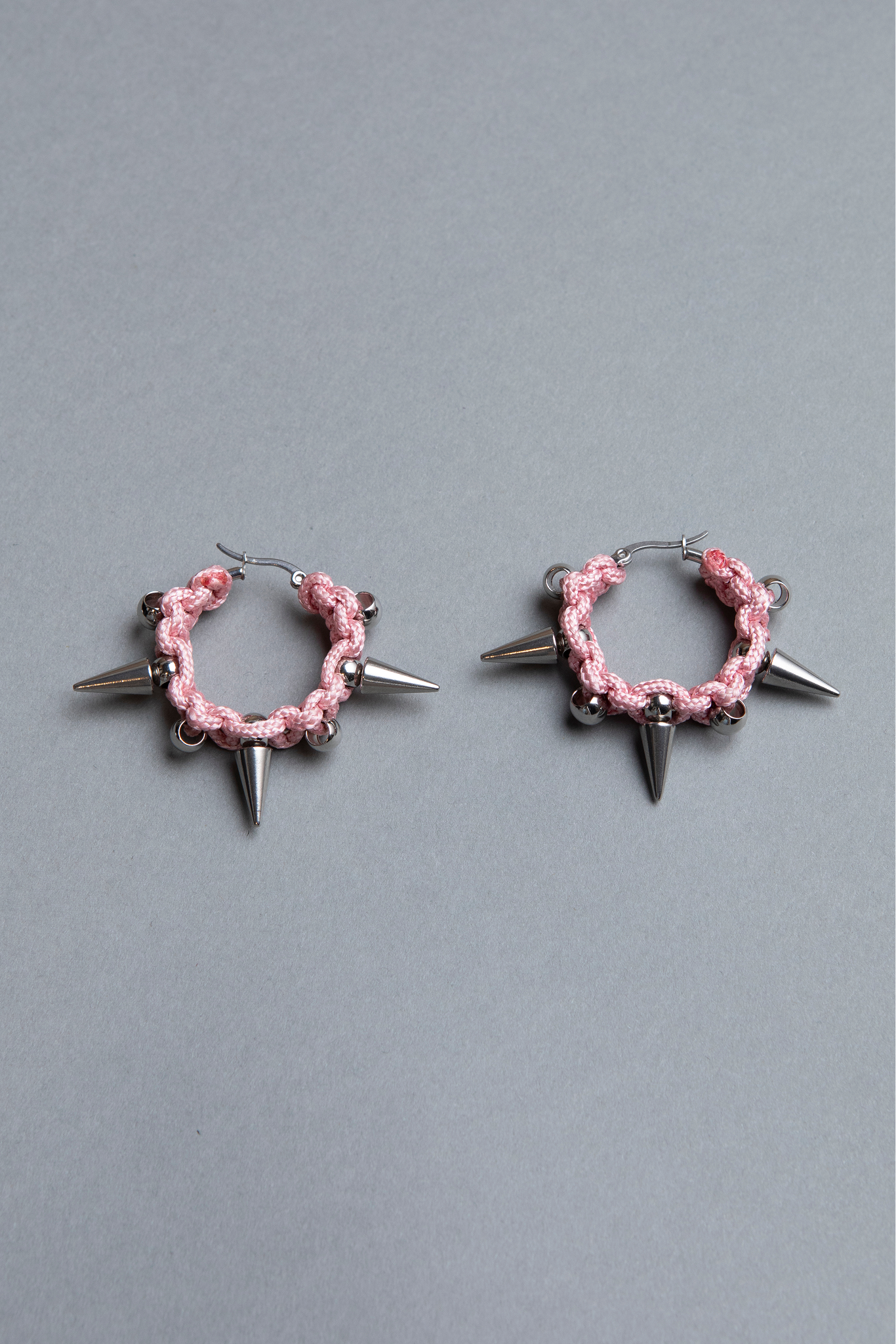 pair of unisex big pair of unisex big pink  spiky hoop earrings 